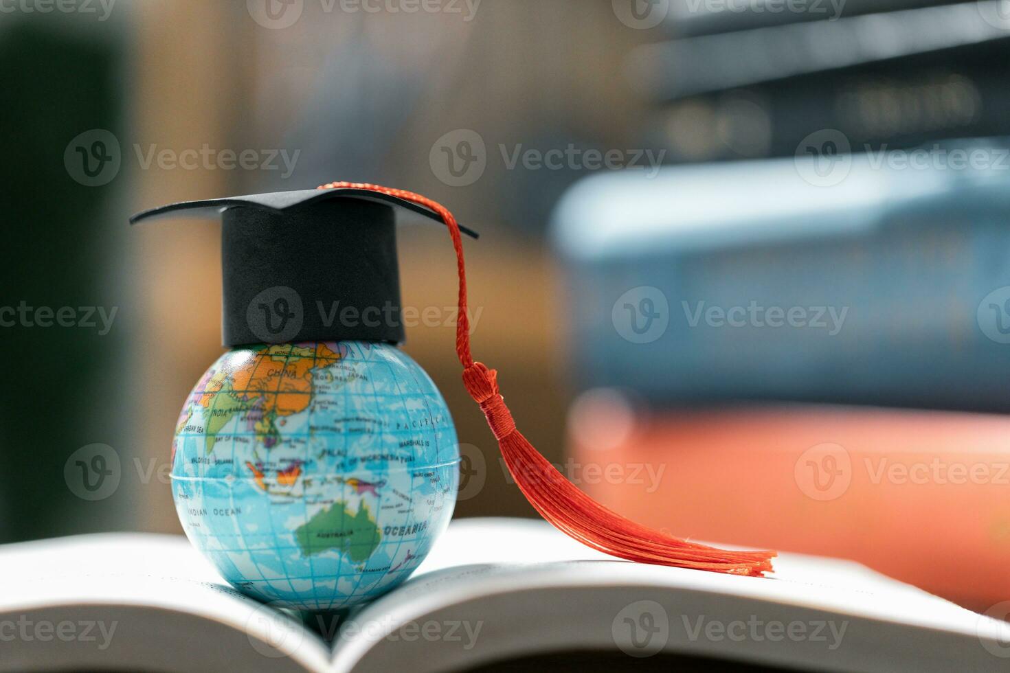 Graduation cap with Earth globe. Concept of global business study, abroad educational, Back to School. Education in Global world, Study abroad business in universities in worldwide. language study photo