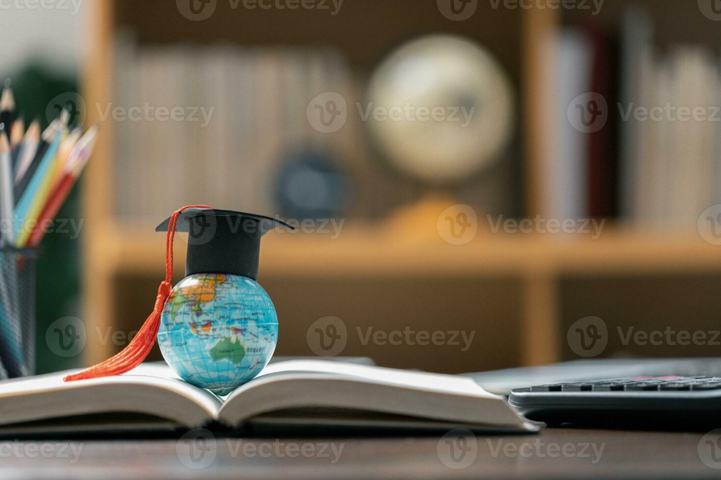 Graduation cap with Earth globe. Concept of global business study, abroad educational, Back to School. Education in Global world, Study abroad business in universities in worldwide. language study photo