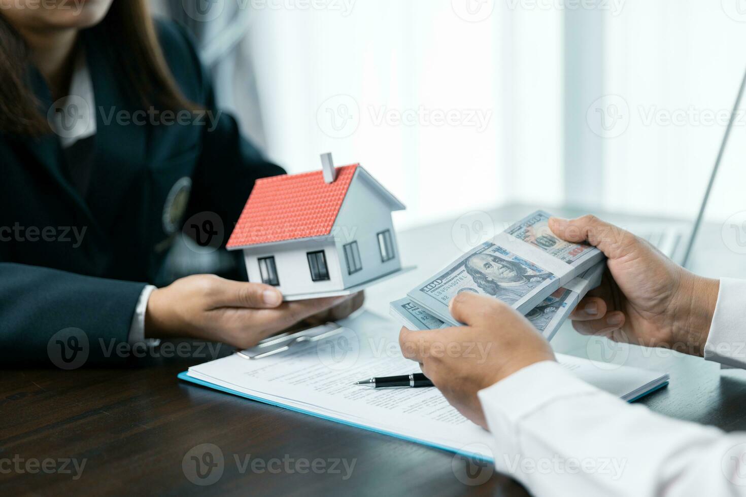 Banks approve loans to buy homes. Real estate agents explain the document for customers who come to contact to buy a house, buy or sell real estate concept. photo