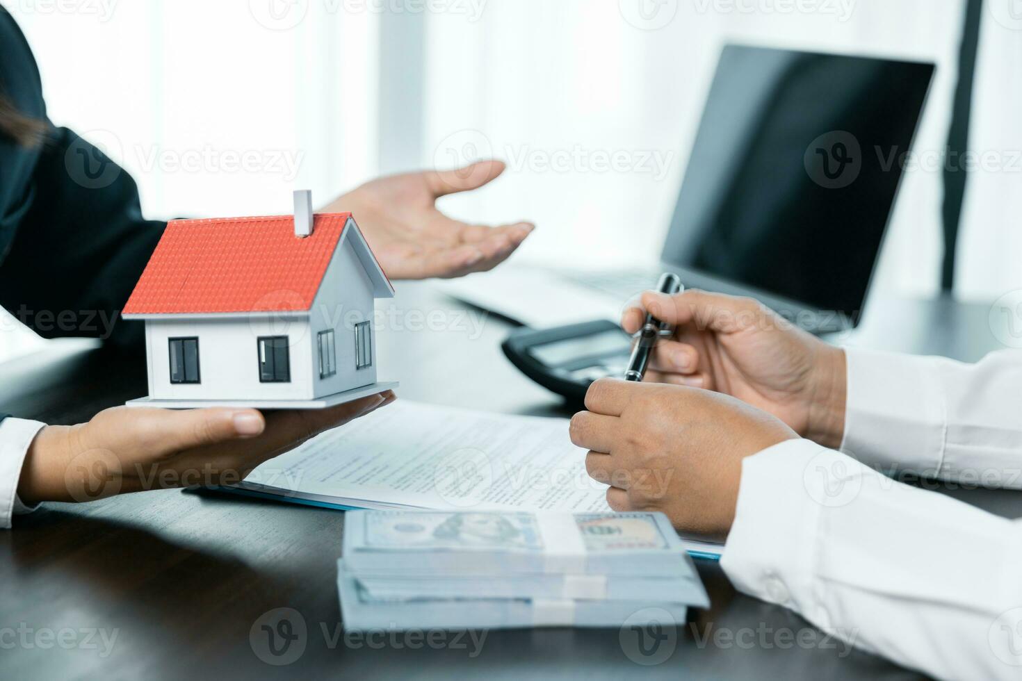 Banks approve loans to buy homes. Real estate agents explain the document for customers who come to contact to buy a house, buy or sell real estate concept. photo