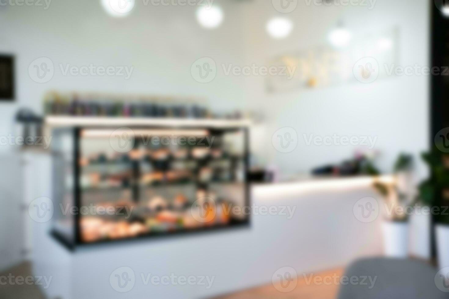 Blurred image of showcase with desserts in a cafe for background. Cafe, bakery. Copy space. photo