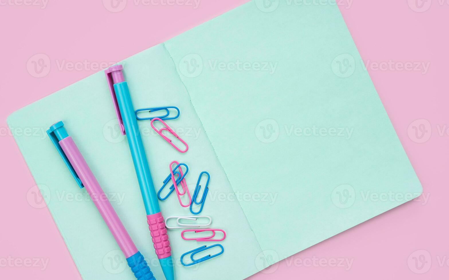 Colorful stationery on a pink background with space for text. Flatlay. Back to school. Top view. photo