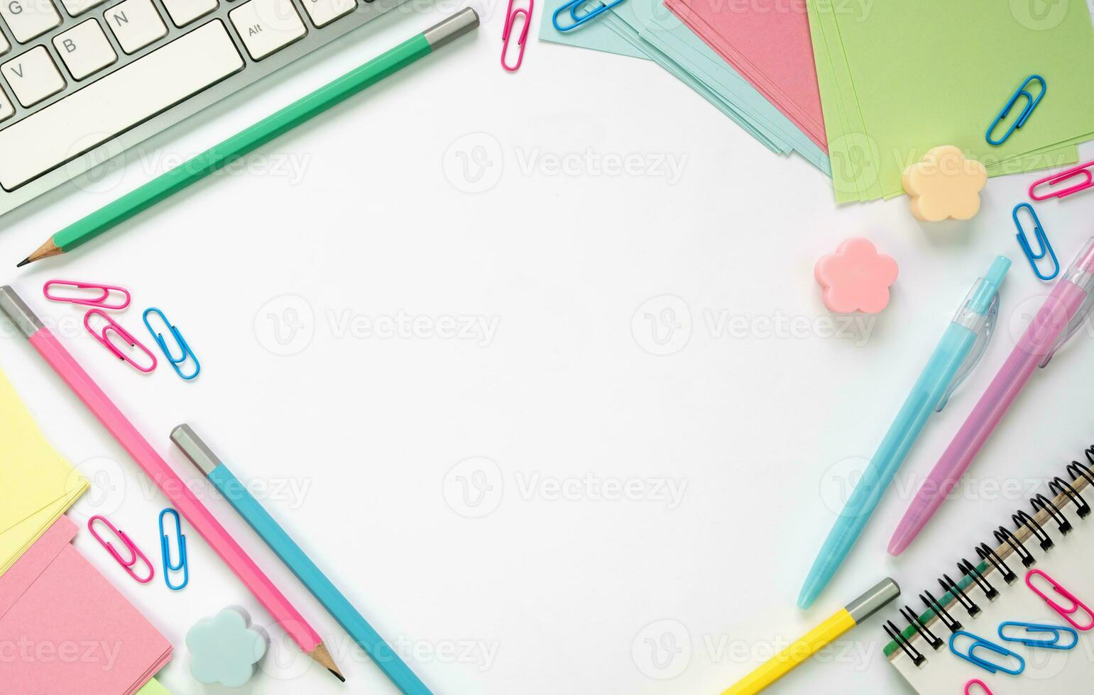 School stationery lie on a white table in the form of a frame. Top view. Copy space. Mockup. Back to school. photo