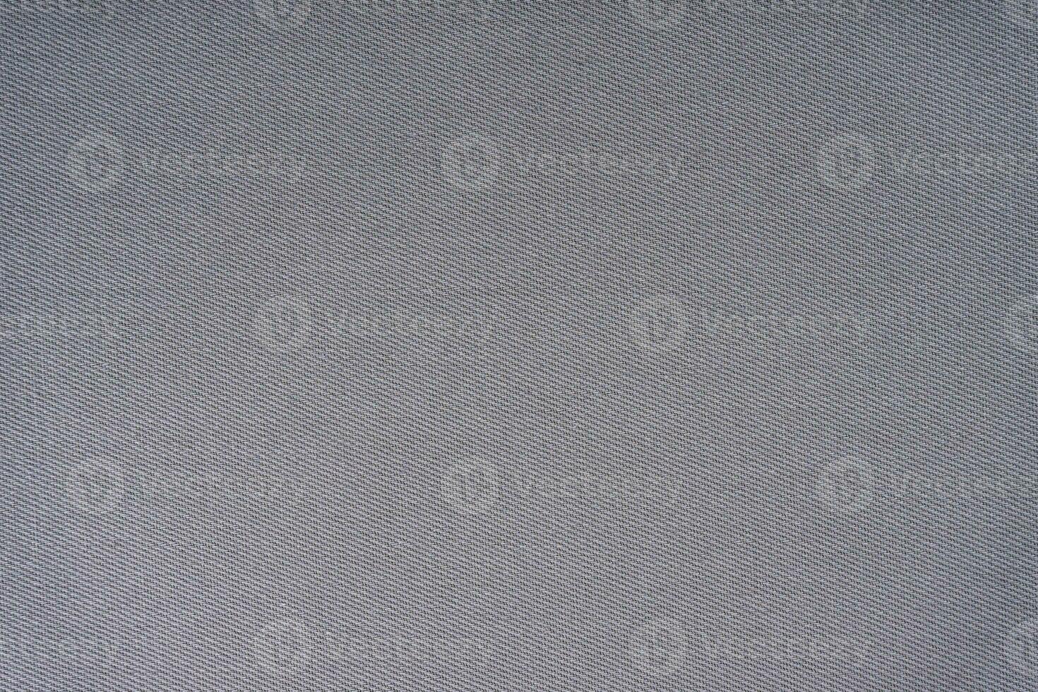 Texture of gray fabric diagonal weave pattern. Decorative textile background photo