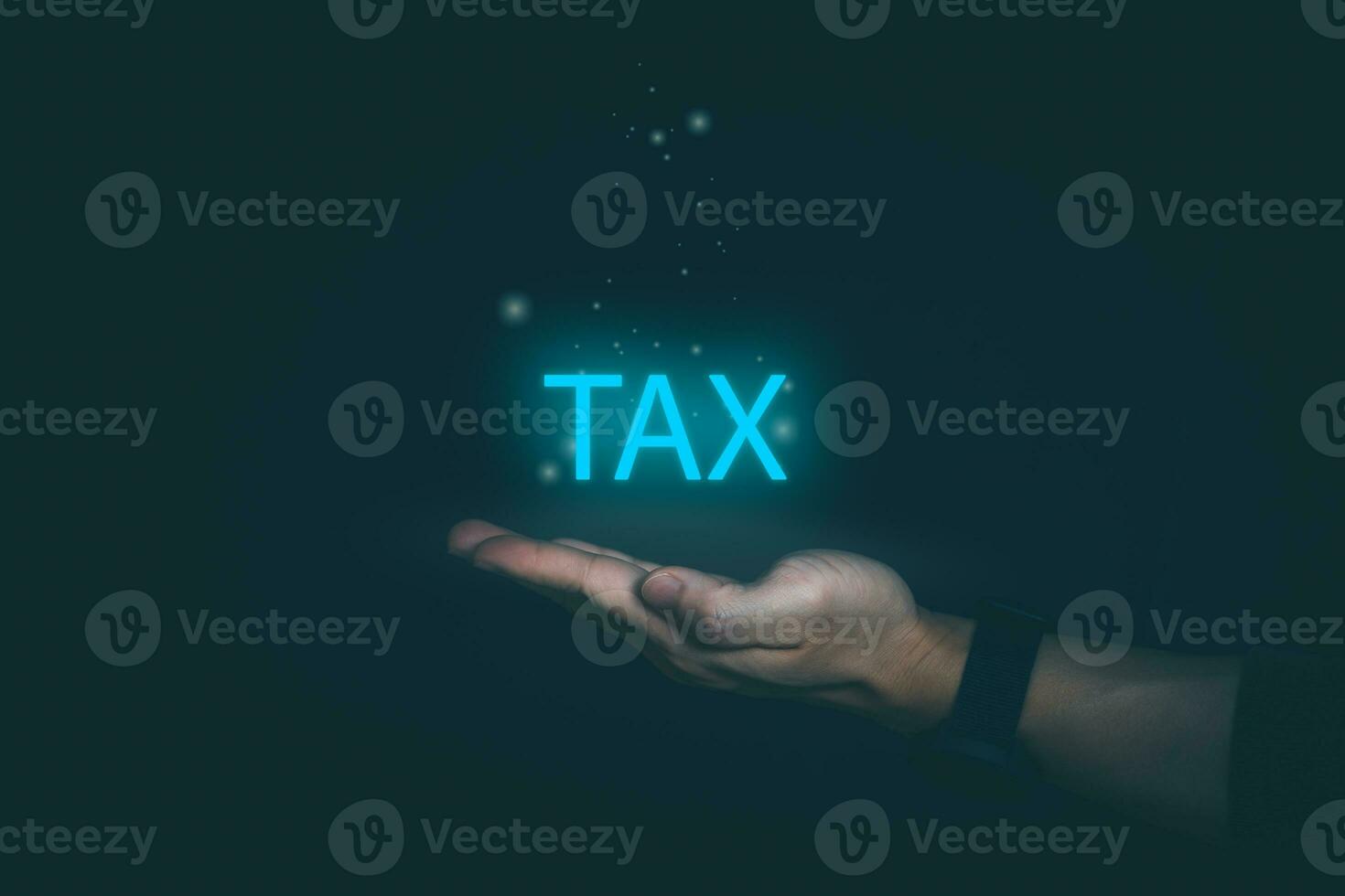 financial research government tax and calculation tax return concept Businessman showing holographic tax on hand Online tax return form filling concept for payment, online marketing, business process. photo