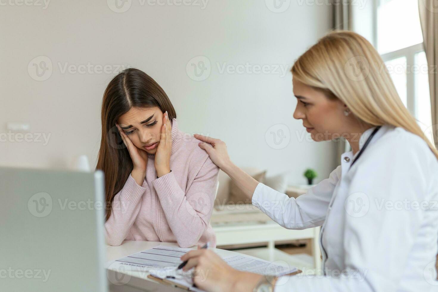 Patient receiving bad news, She is desperate and crying, Doctor support and comforting her patient with sympathy. Don't worry, this medical test is not so bad photo