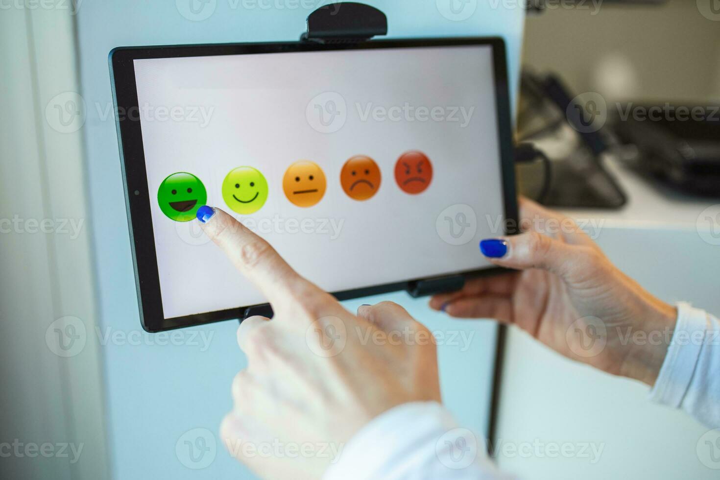 Customer hand pressing on tablet to give review, opinion and feedback to survey, poll or questionnaire for user experience or satisfaction research. service quality control. Rating concept. photo