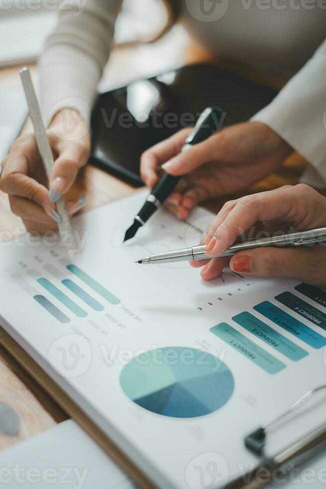 Group of business people analysis summary graph reports of business operating expenses and work data about the company's financial statements. photo