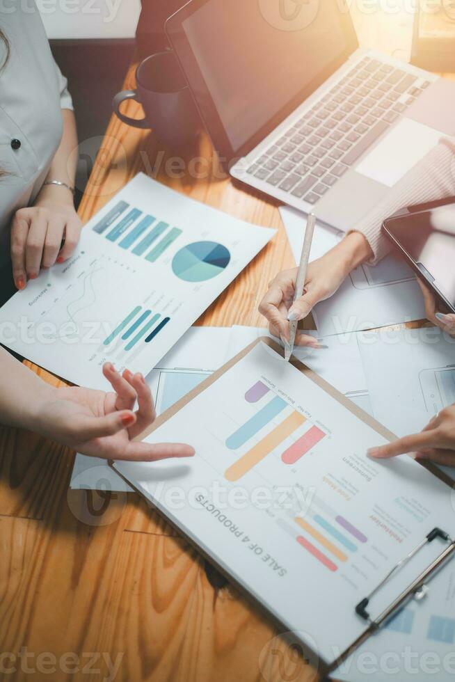 Group of business people analysis summary graph reports of business operating expenses and work data about the company's financial statements. photo