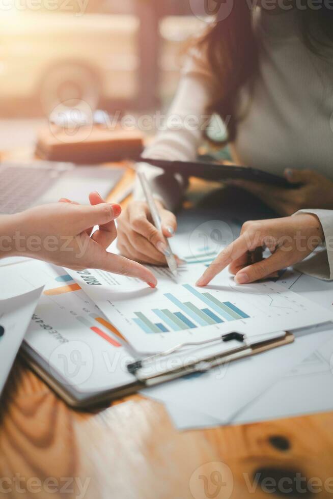 Group of business people analysis summary graph reports of business operating expenses and work data about the company's financial statements. photo