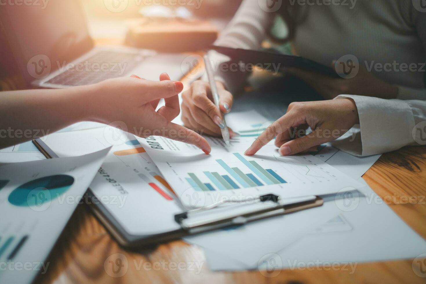 Group of business people analysis summary graph reports of business operating expenses and work data about the company's financial statements. photo