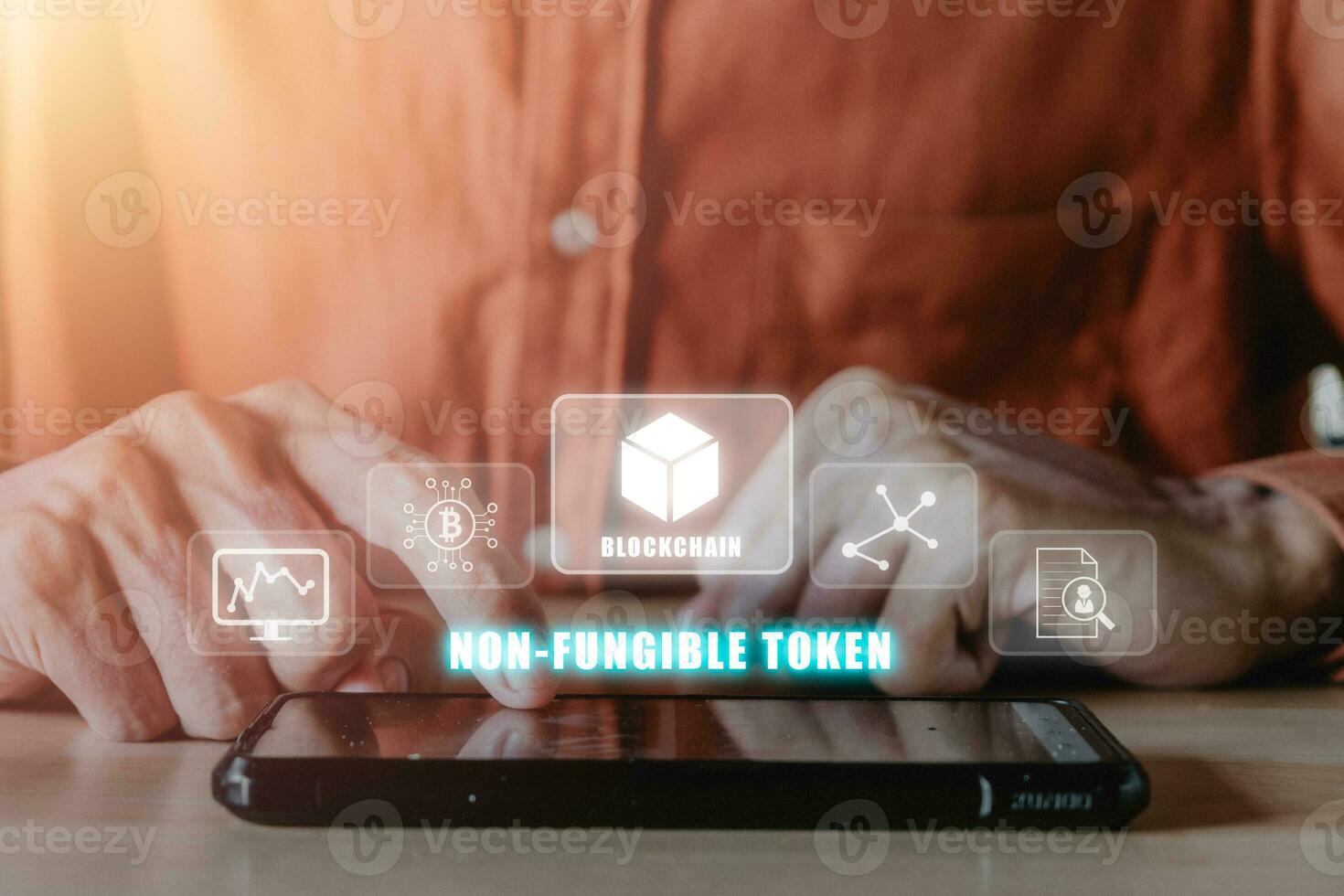 FT token digital crypto art blockchain technology concept, Person hand using smartphone with NFT icon on virtual screen. photo