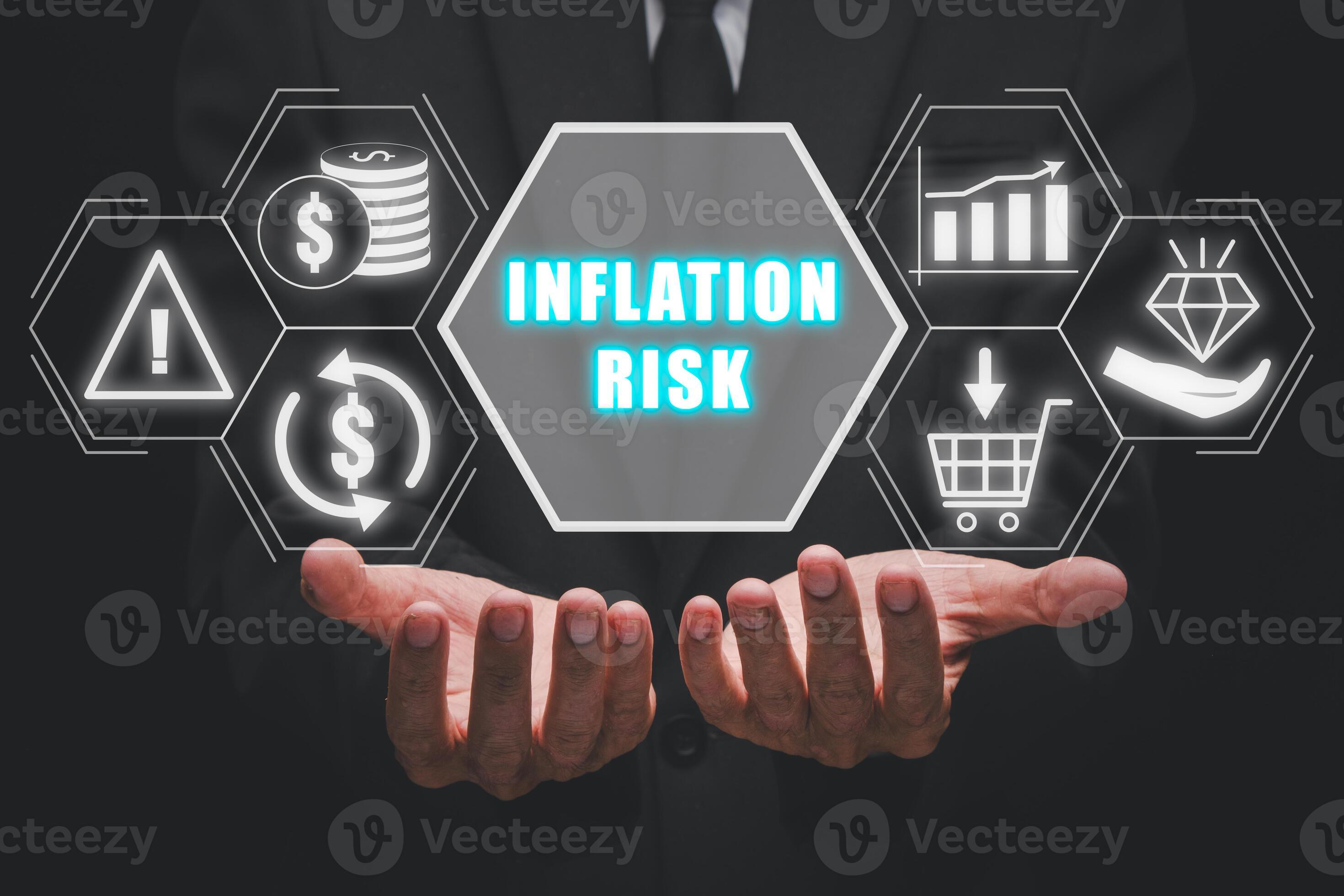 Inflation risk concept, Businessman hand holding inflation risk icon on