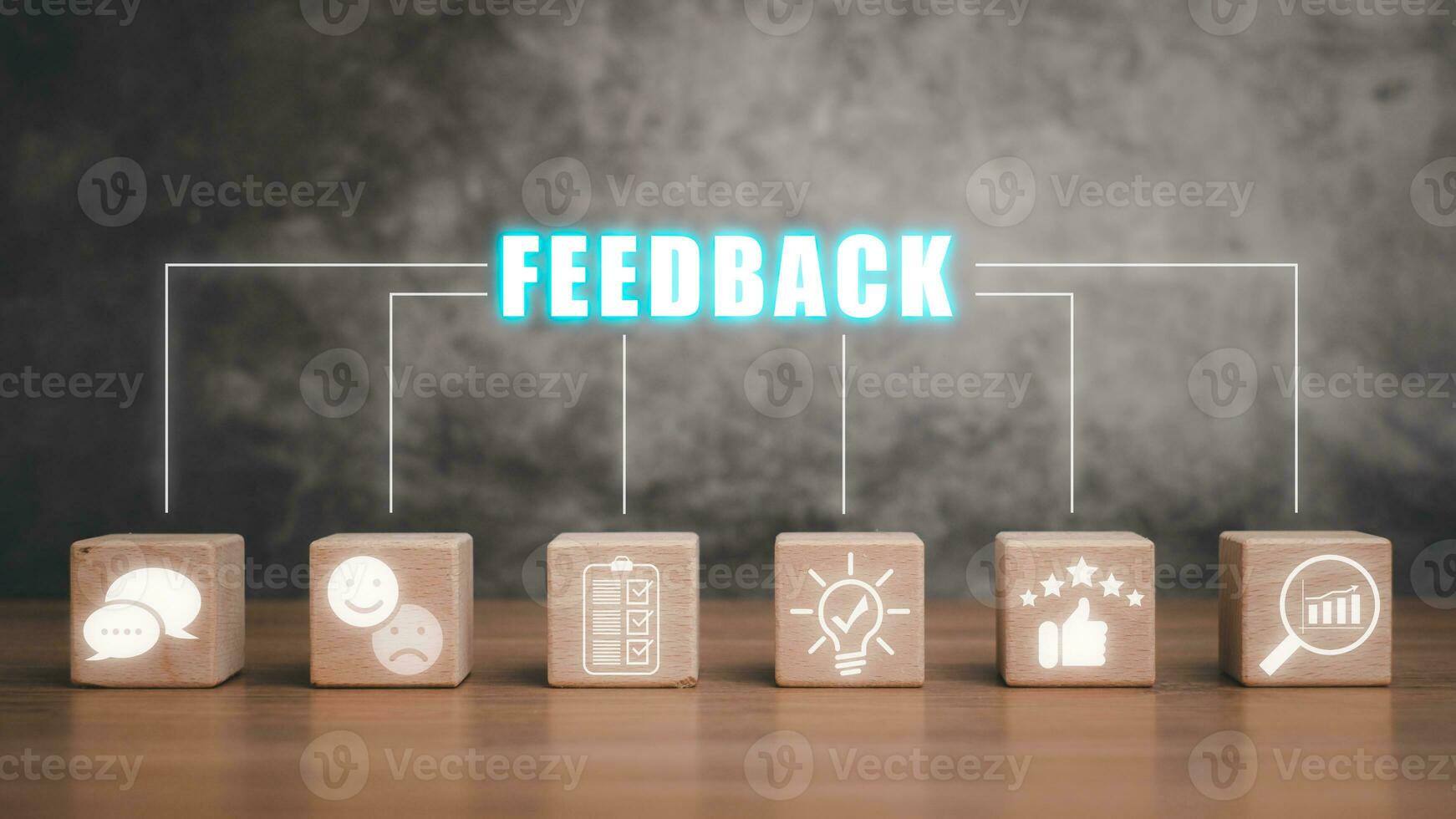 Feedback concept, Wooden block on desk with feedback icon on virtual screen. photo