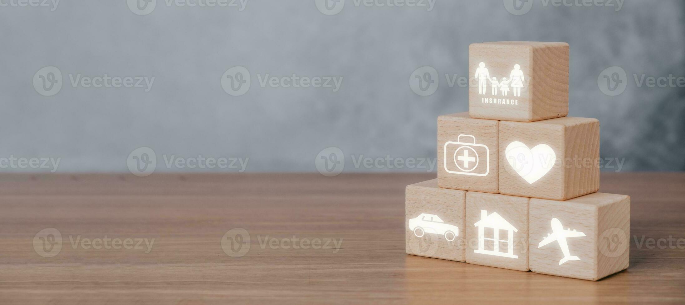 Insurance company client take out complete insurance concept, Wooden block stack with Insurance icon on vr screen, copy space. photo