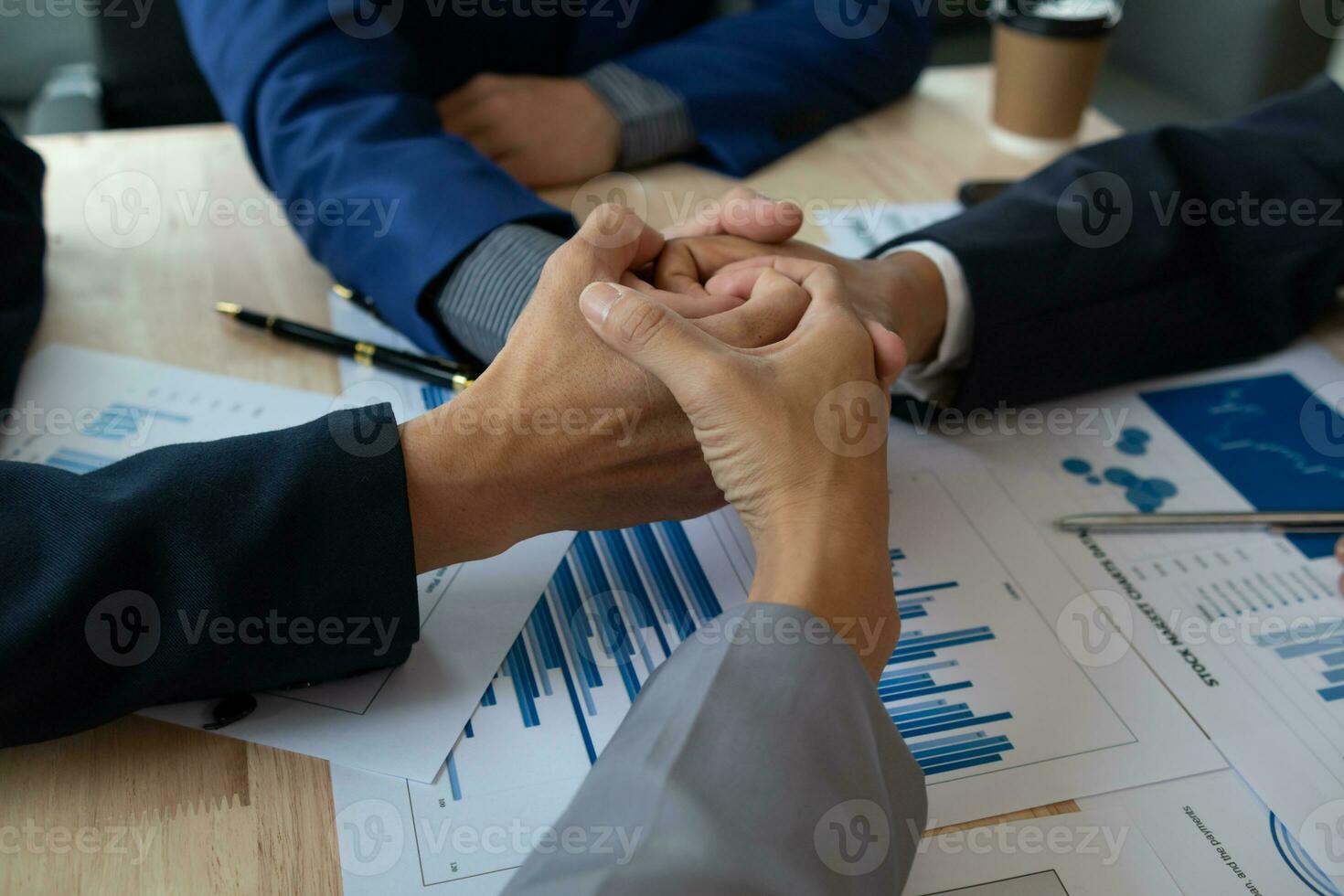 A group of businesspeople and investors meet to discuss market's success in past quarter. idea of setting up a marketing consulting team and working together as a team made it a success. photo