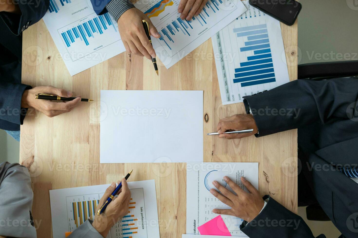 A group of businesspeople and investors meet to discuss market's success in past quarter. idea of setting up a marketing consulting team and working together as a team made it a success. photo