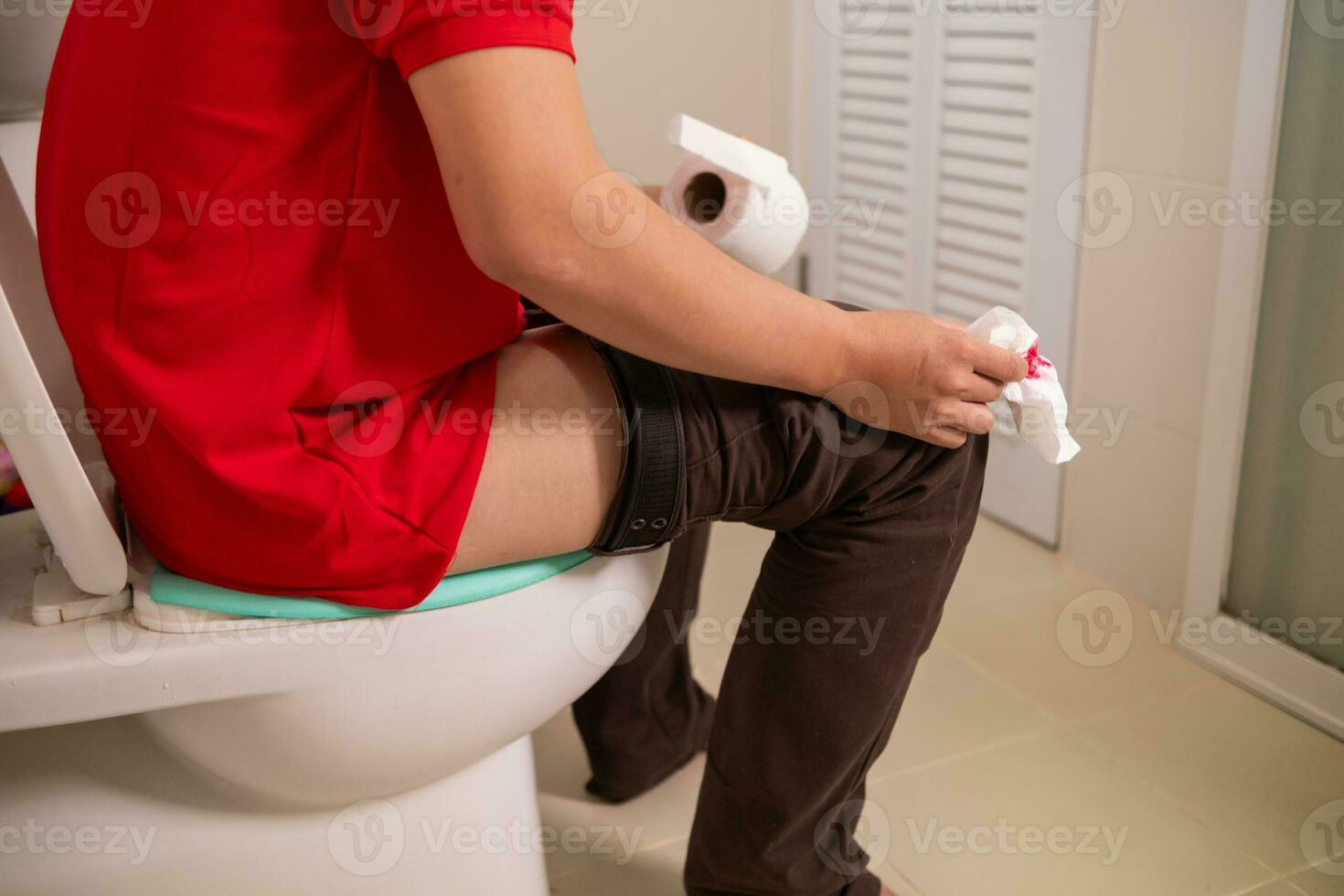 man has hemorrhoids that have worsened and enlarged, and hemorrhoids are severely inflamed, causing bleeding when defecation, infection, weakness and fainting. Inflammatory hemorrhoids pain concept photo