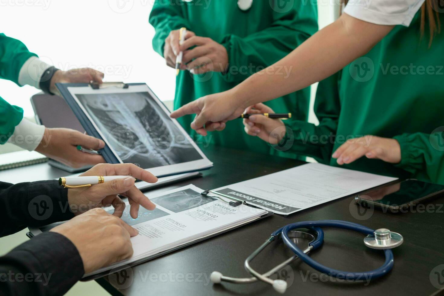 The doctor joins a meeting with the surgeon's team to discuss a plan for cancer surgery after the medical team detects cancer. Collaborative concept of a team doctors and surgeons in surgery. photo