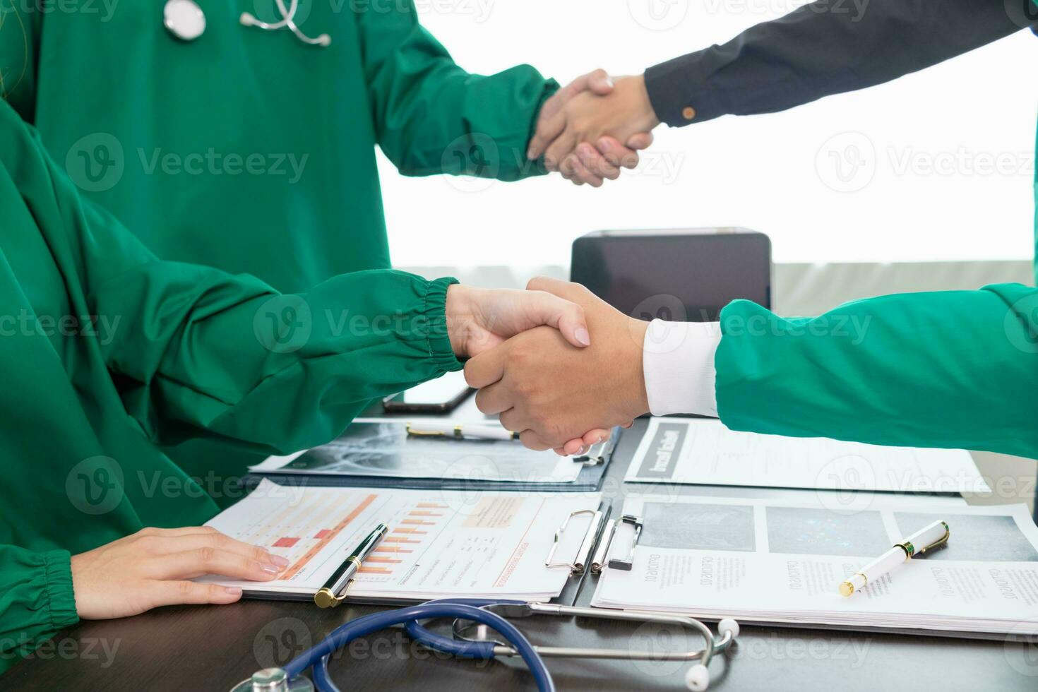 medical join hands with surgeon team to show confidence after medical team has discussed cancer surgery plans with surgeon team. Collaborative concept of doctors and surgeons in surgery. photo