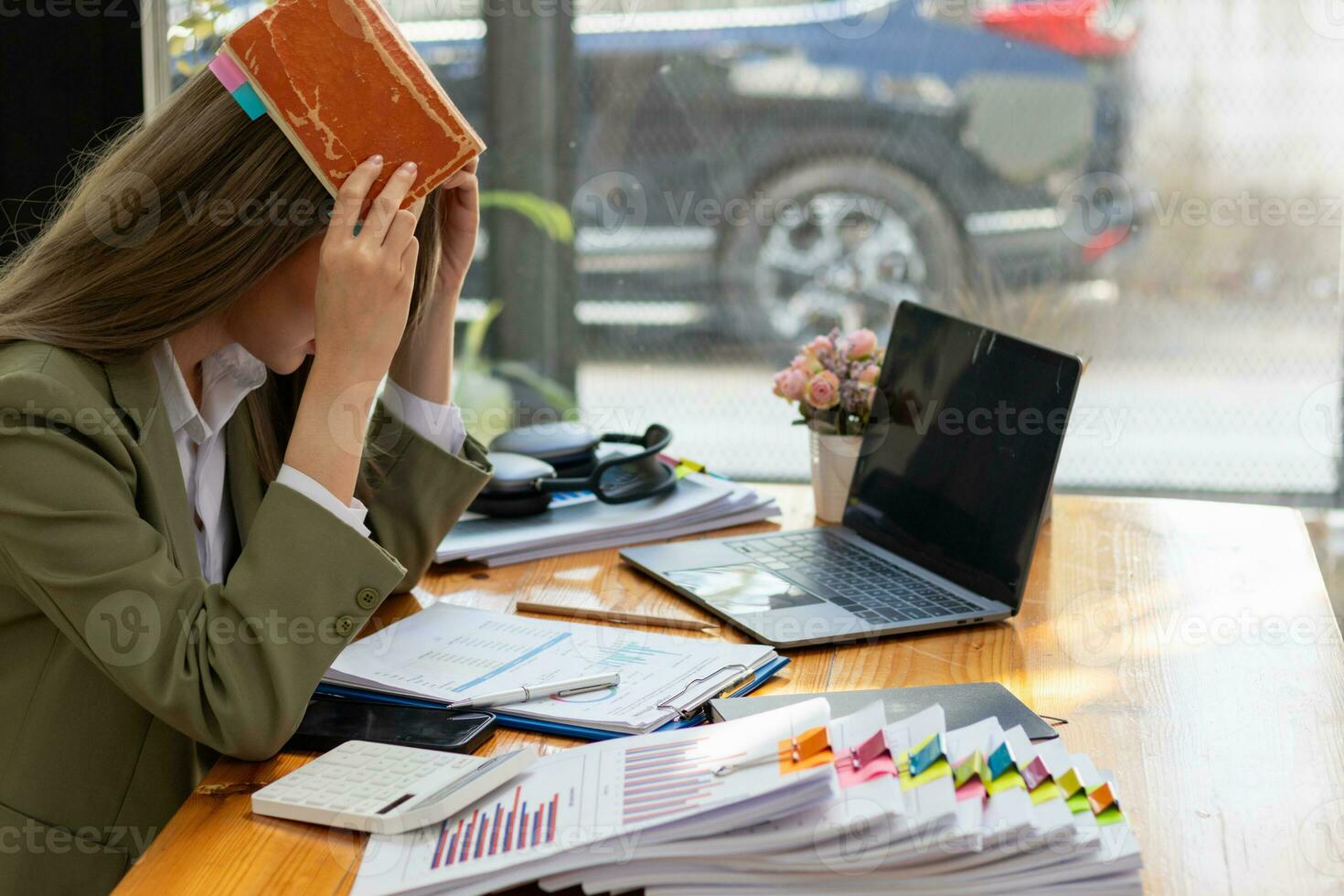 stack of documents on secretary desk were prepared It is legal document for real estate buyers to be used as evidence of possession. stacked papers were placed on the table awaiting examination. photo