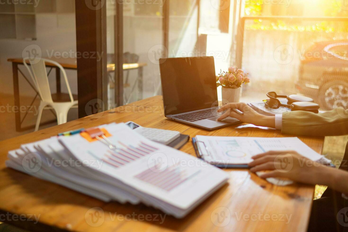 stack of documents on secretary desk were prepared It is legal document for real estate buyers to be used as evidence of possession. stacked papers were placed on the table awaiting examination. photo