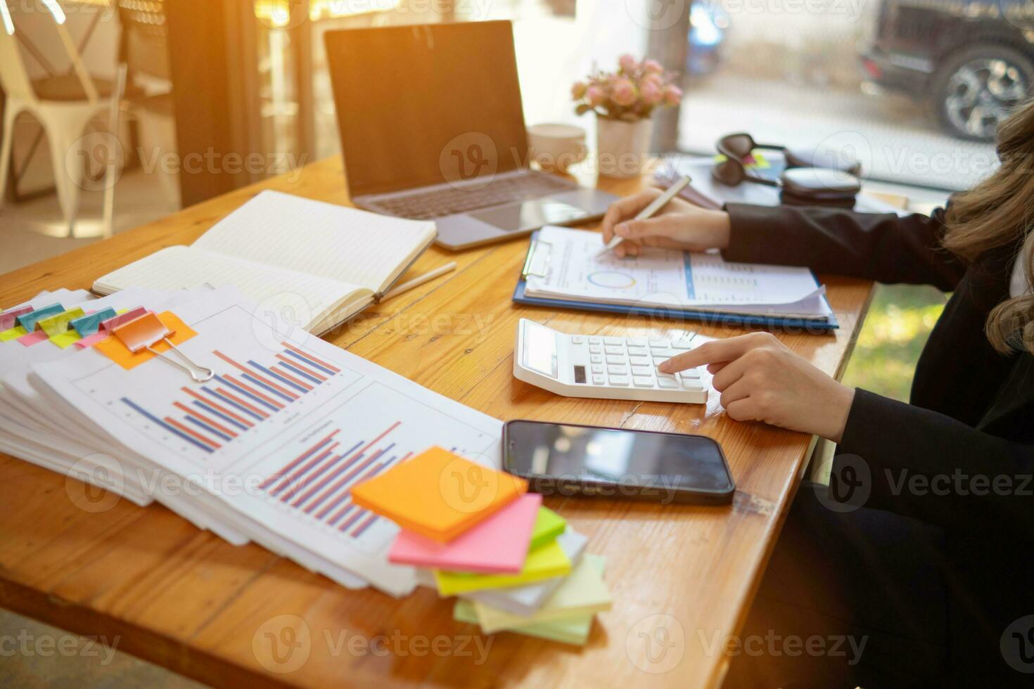 stack of documents on secretary desk were prepared It is legal document for real estate buyers to be used as evidence of possession. stacked papers were placed on the table awaiting examination. photo