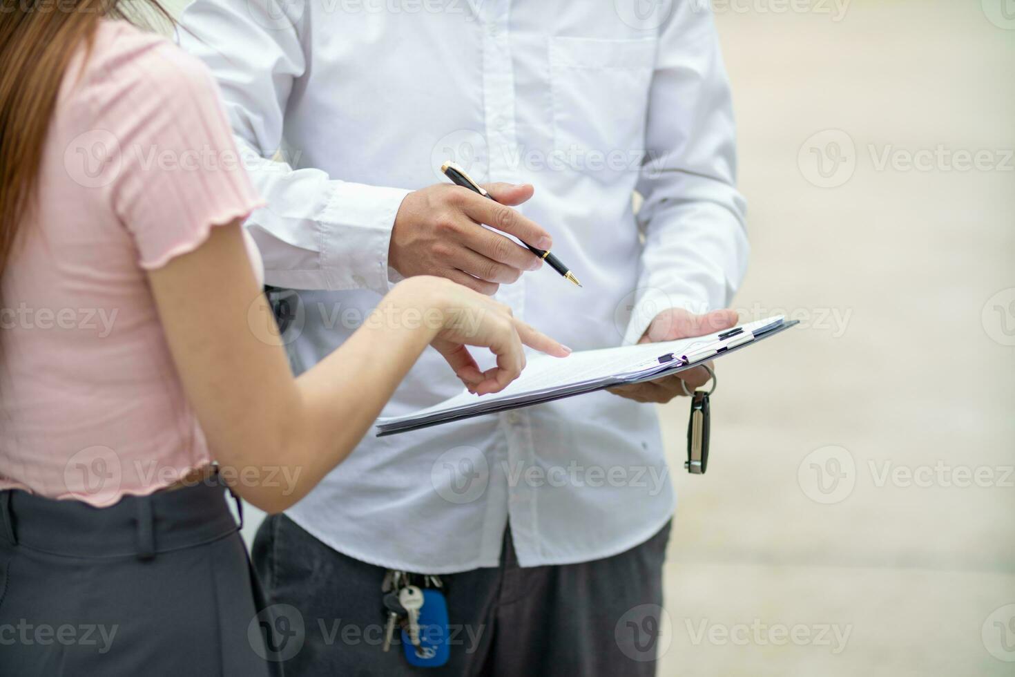 Insurance agents meet with customers when accidents occur to inspect damage and document insurance claims expeditiously. concept of car insurance agents to urgently inspect damage for customers. photo