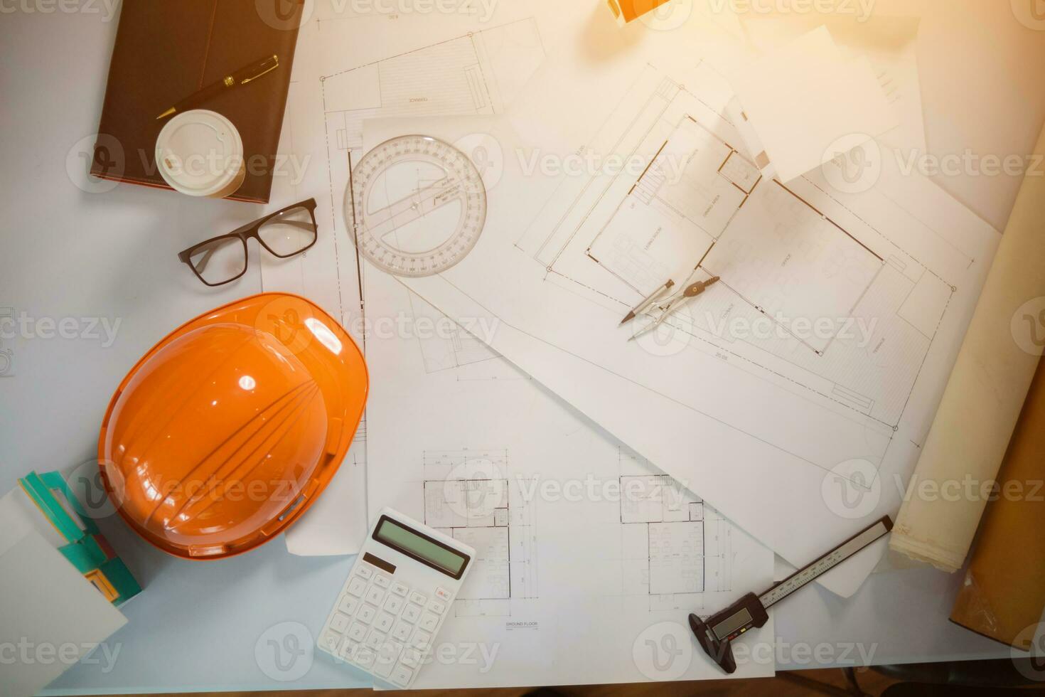 Equipment and drawings lying on desks inside the offices of architects and engineers. background of an architect's workbench getting ready for work to achieve the desired outcome of the client. photo