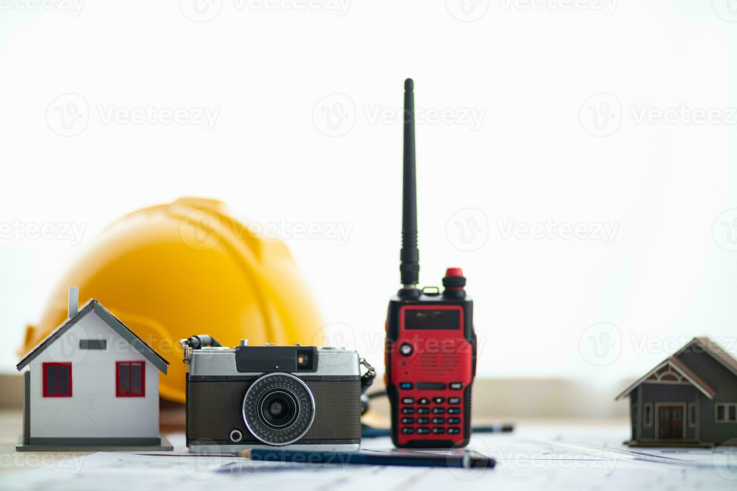 Yellow helmet were prepared for Construction engineers to wear before entering the construction area to prevent  danger of falling objects from working. Yellow safety helmet is placed on white table. photo
