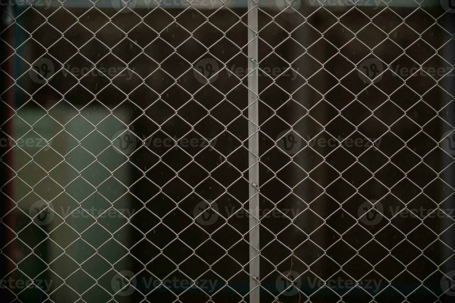 Steel mesh is used as temporary fence to mark boundaries of private property because it is durable and easy install as fence. steel mesh background is installed to prevent intrusion and has copy space photo