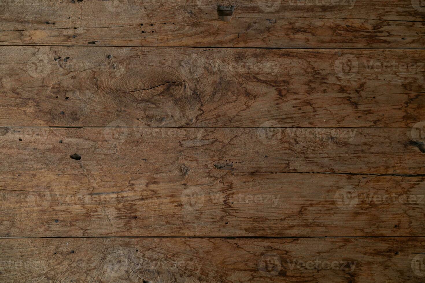 background old wooden wall that shows signs of cracking and deterioration from weather and age. Wooden wall backgrounds with natural textures are ideal for design and Copy Space backgrounds. photo