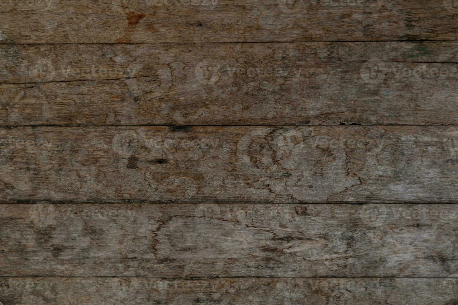 background old wooden wall that shows signs of cracking and deterioration from weather and age. Wooden wall backgrounds with natural textures are ideal for design and Copy Space backgrounds. photo