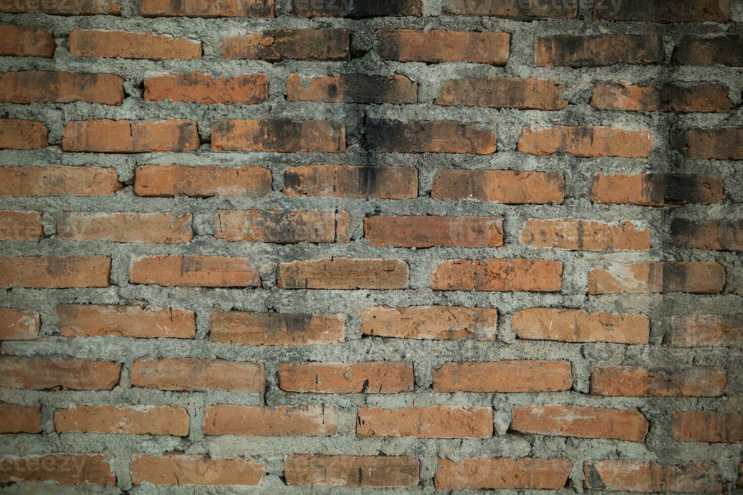 background old concrete wall that is waiting to be renovated by construction engineering team and brick wall background that is suitable for designers to use in their designs because it has Copy Space photo