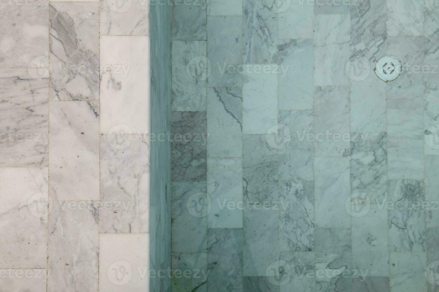 Marble tile backgrounds with beautiful natural patterns are used for flooring and interior swimming pools because they are easy to clean. Marble tile background  and Copy Space for inserting text. photo