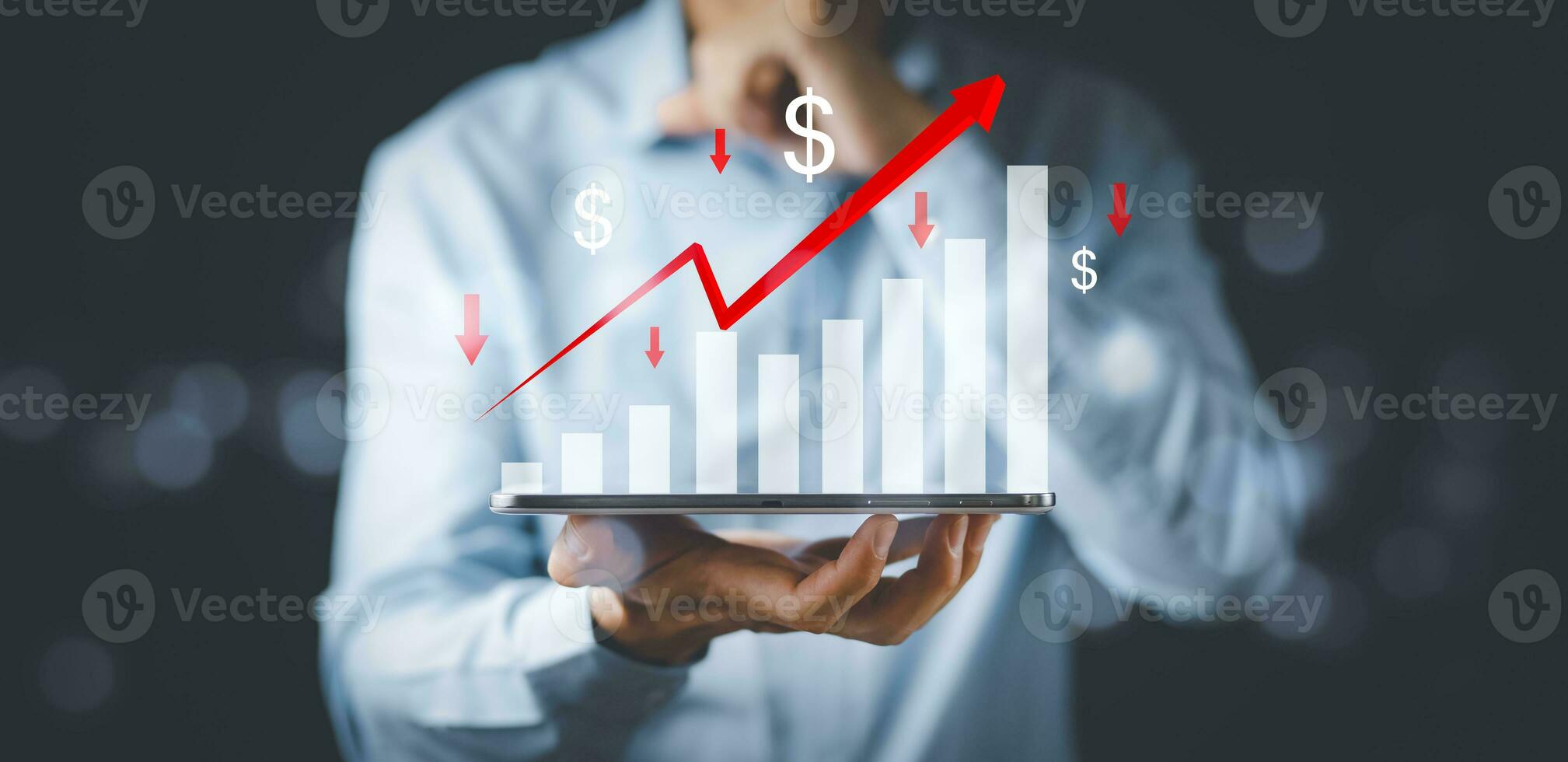 Businessman holding tablet bar graph and red arrow of analytics and financial, Changes in new planning, Business growth, ideas and perspectives, Stock investment, and dividends yield from business. photo