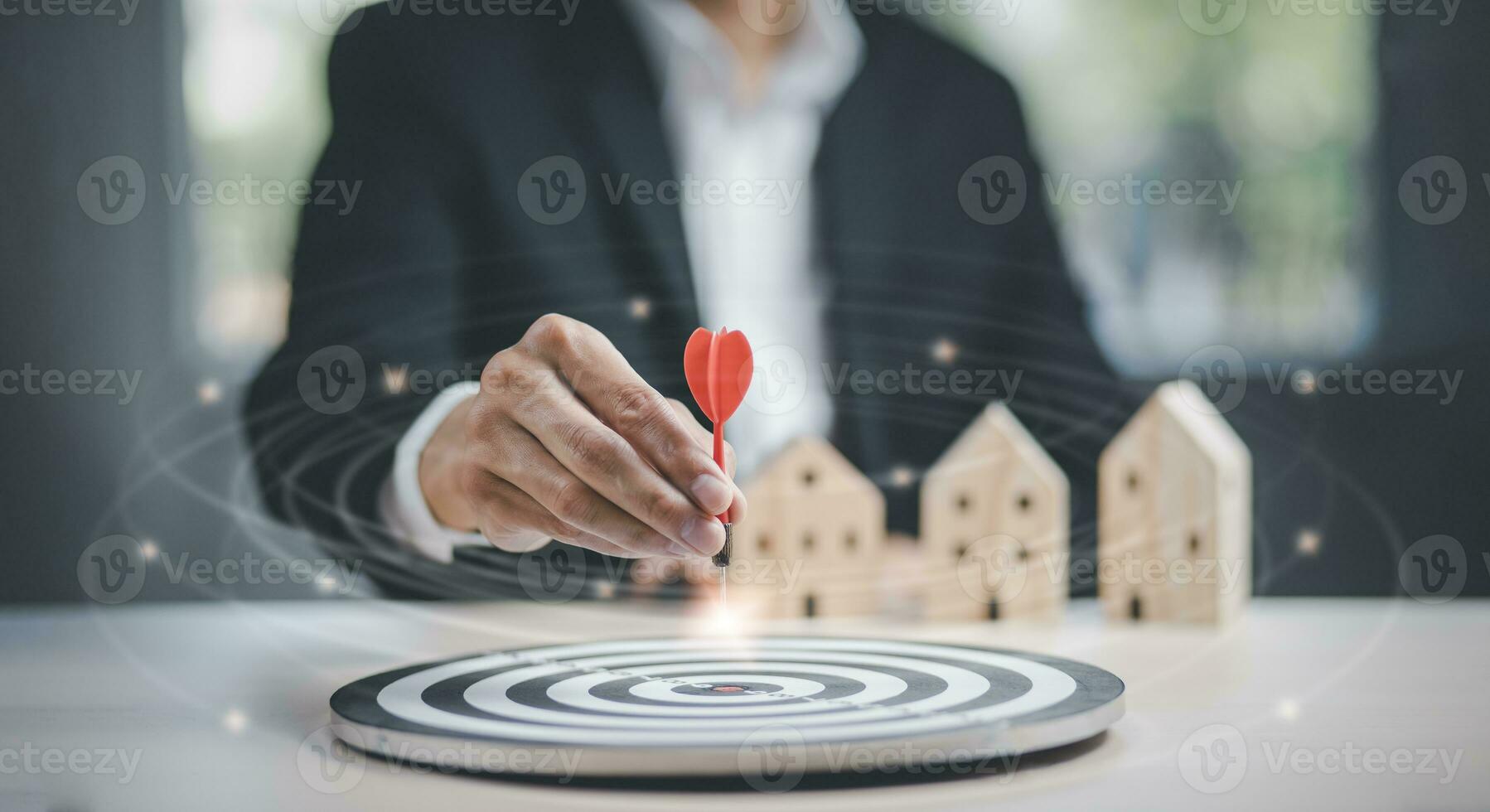 Targeting the business concept, Businessman touch red arrow dart to the virtual target dartboard, Executive marketing, investment goal and target for business investment concept, mini home. photo