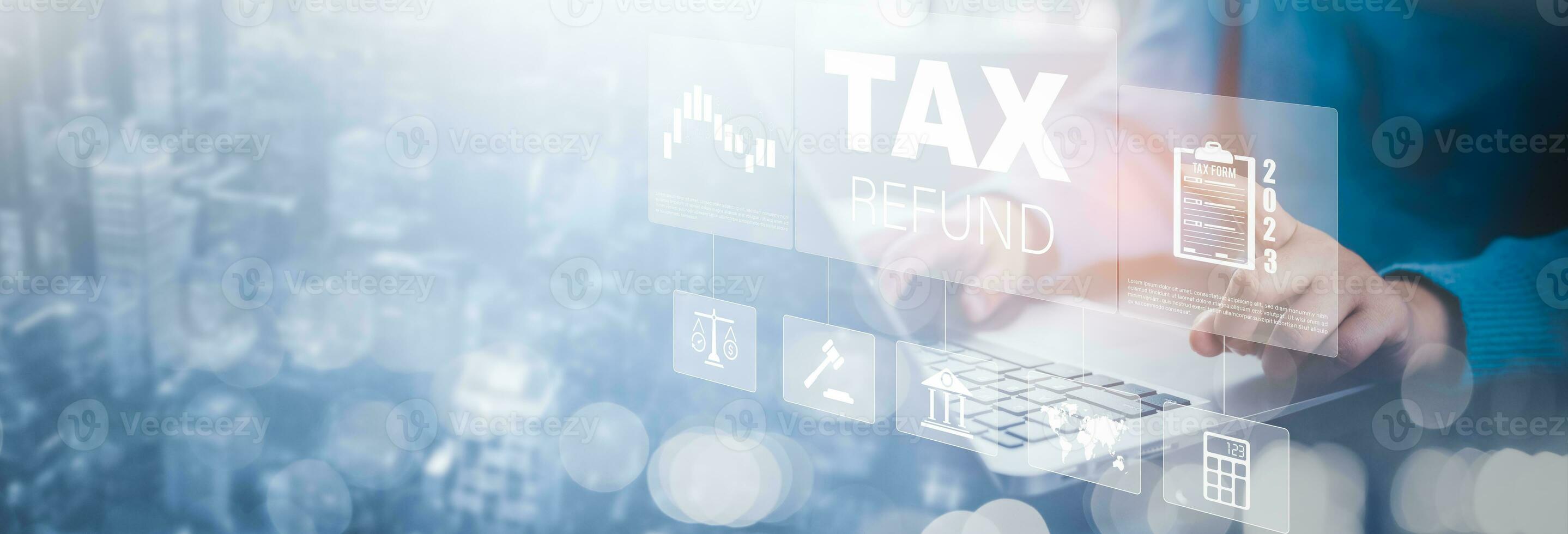 Hand using a laptop with TAX REFUND and refund tax of duty taxation business, graphs and chart being demonstrated on the screen media,  tablet pc and selecting tax refund, Saving tax for business photo