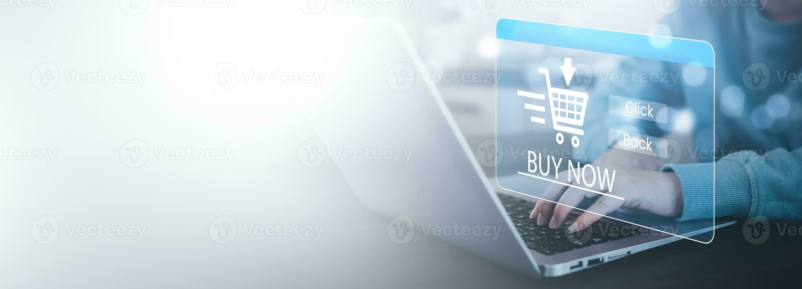 Man using a laptop with typing on a keyboard with online shopping concept, Shopping cart part of the network in hand, Innovation in eCommerce, Online shopping business with selecting shopping cart. photo