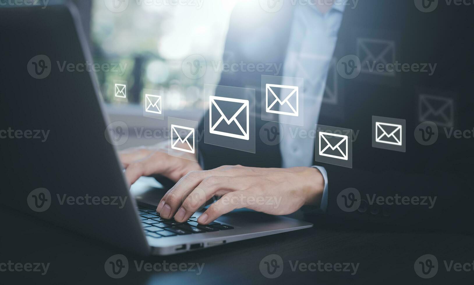 Businesswoman holding smartphone with communication icons, letter icon, email icons, and newsletter email and protect your personal information or spam mail, Customer service call center contact. photo