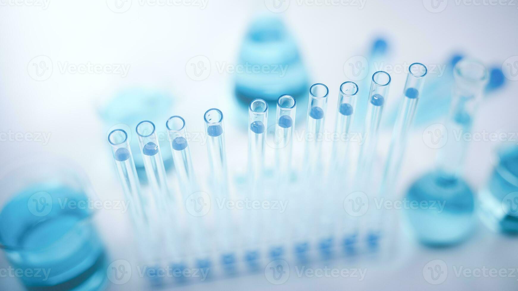 Microscope with lab glassware, nanotechnology conducting research fiber microfiber microbiology medicine healthcare pharma production lab laboratory science, drop-over test tubes in a research lab photo