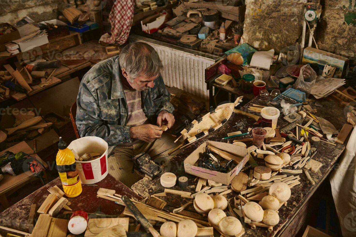 Wooden handmade sailboat in carpentry workshop. photo