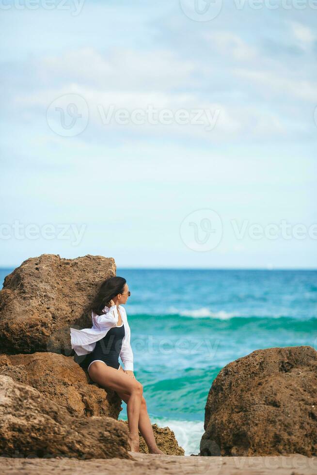 Young beautiful woman on the beach vacation photo