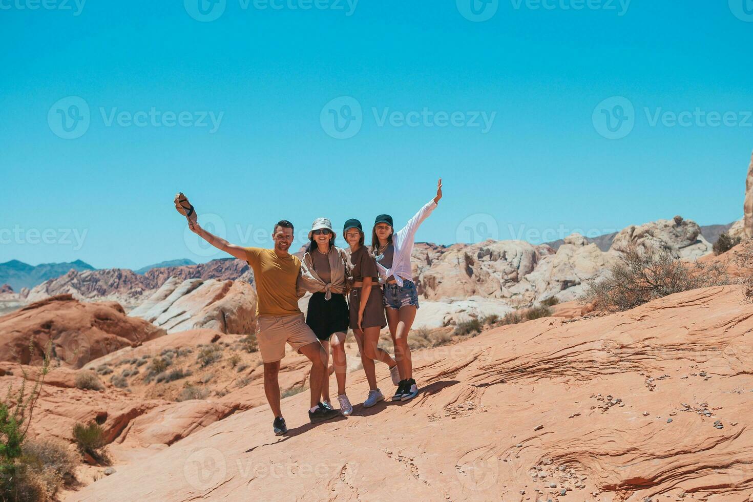 Family on trail at Fire Valley in Utah photo