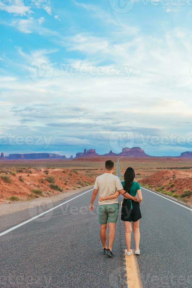 Happy couple on the famous road to Monument Valley in Utah. Amazing view of the Monument valley. photo