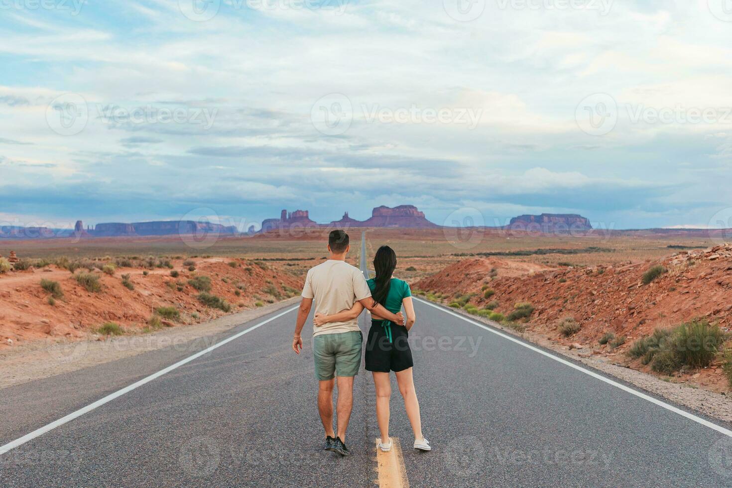Happy couple on the famous road to Monument Valley in Utah. Amazing view of the Monument valley. photo