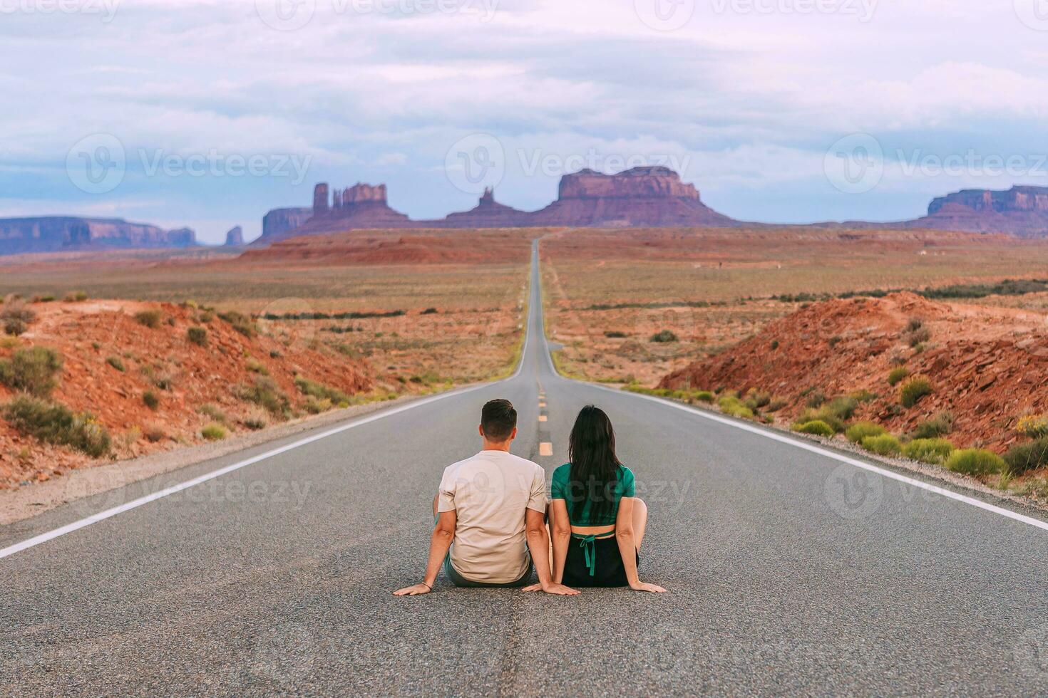 Happy couple on the famous road to Monument Valley in Utah. Amazing view of the Monument valley. photo