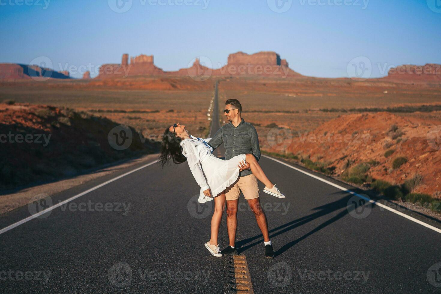 Scenic highway in Monument Valley Tribal Park in Utah. Young family on famous road in Monument Valley photo