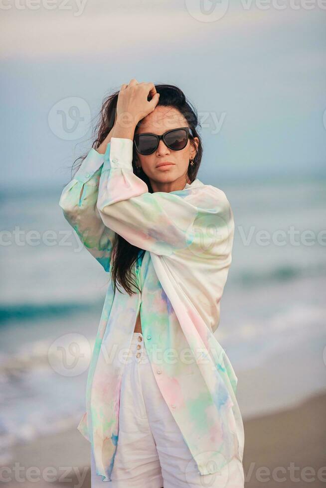 Young beautiful woman on beach vacation on Caribs photo