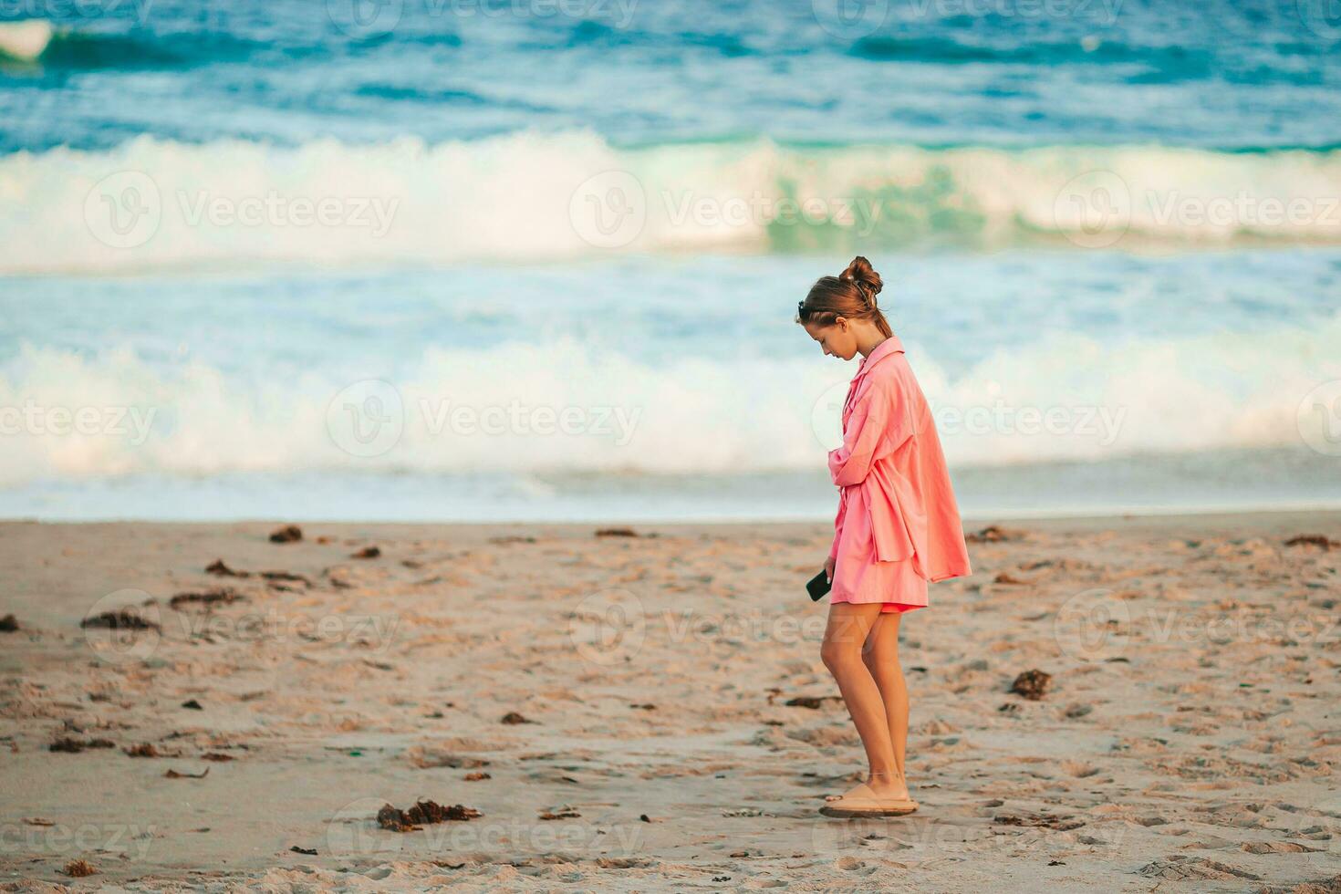 Happy young girl enjoy tropical beach vacation photo